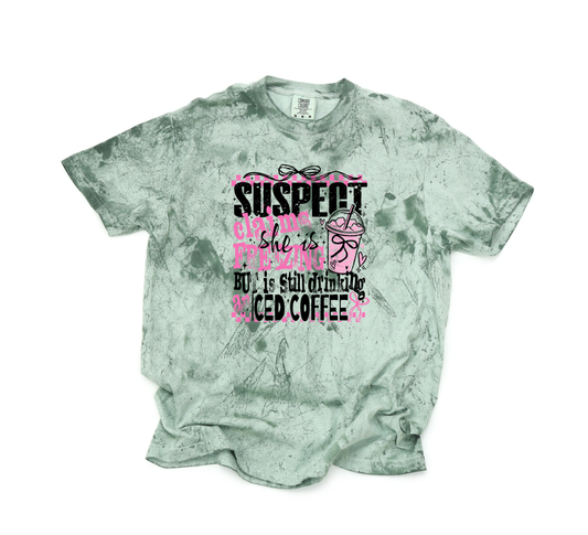 SUSPECT CLAIMS SHE IS FREEZING BUT IS STILL DRINKING ICED COFFEE CC SHIRT